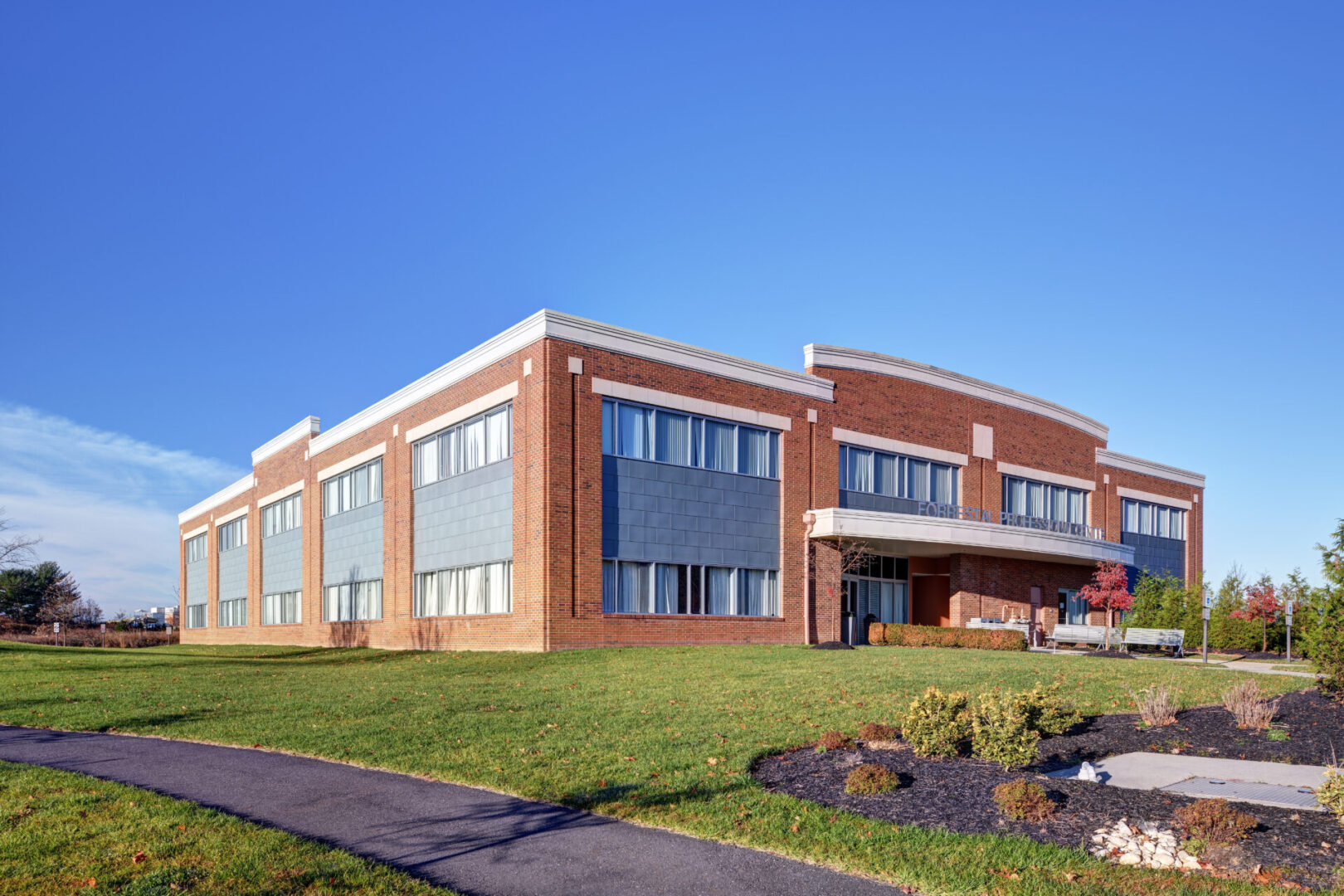 A building with a grassy area in front of it