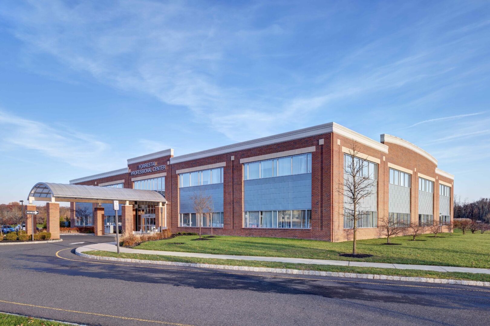 A large brick building with a blue sky in the background.