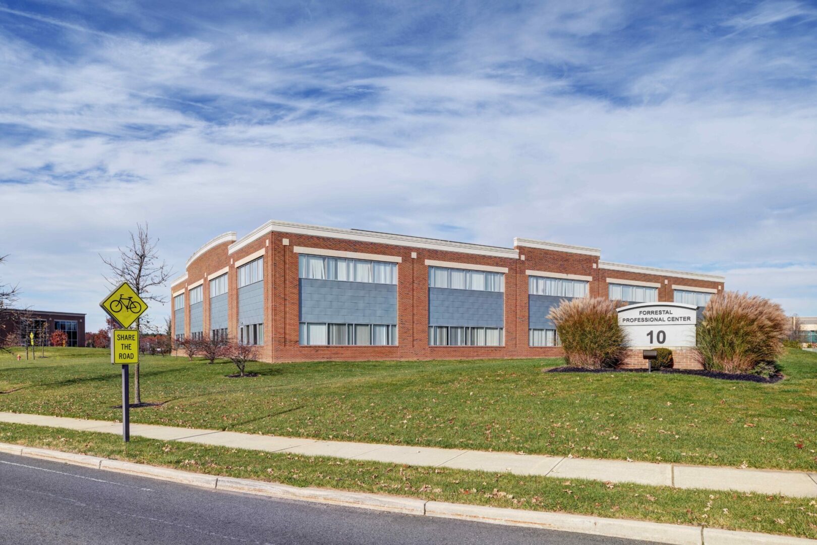 A building with a large lawn in front of it