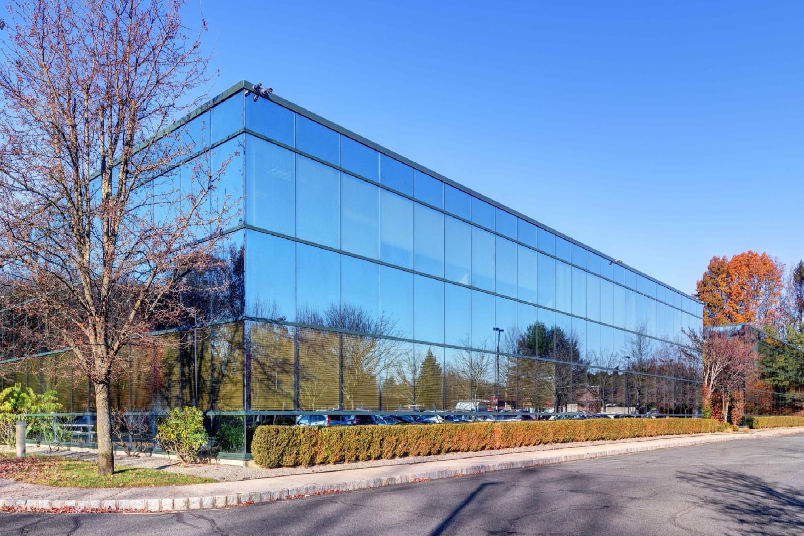 A large building with many windows on the side of it.