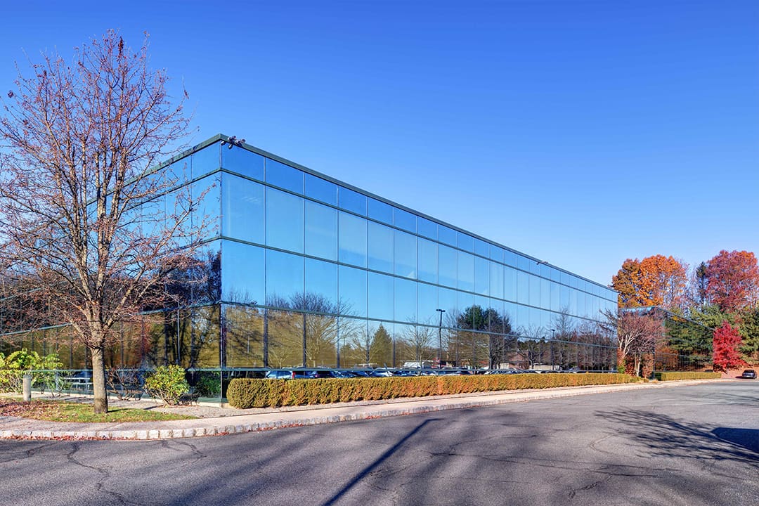 A large building with many windows on the side of it.