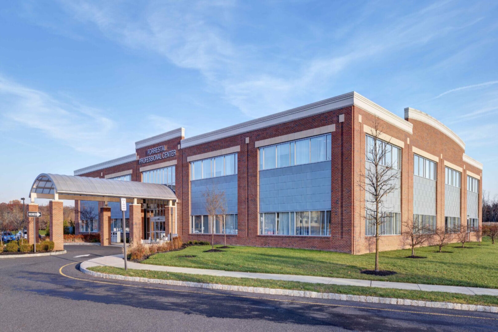 A large brick building with many windows on the side.